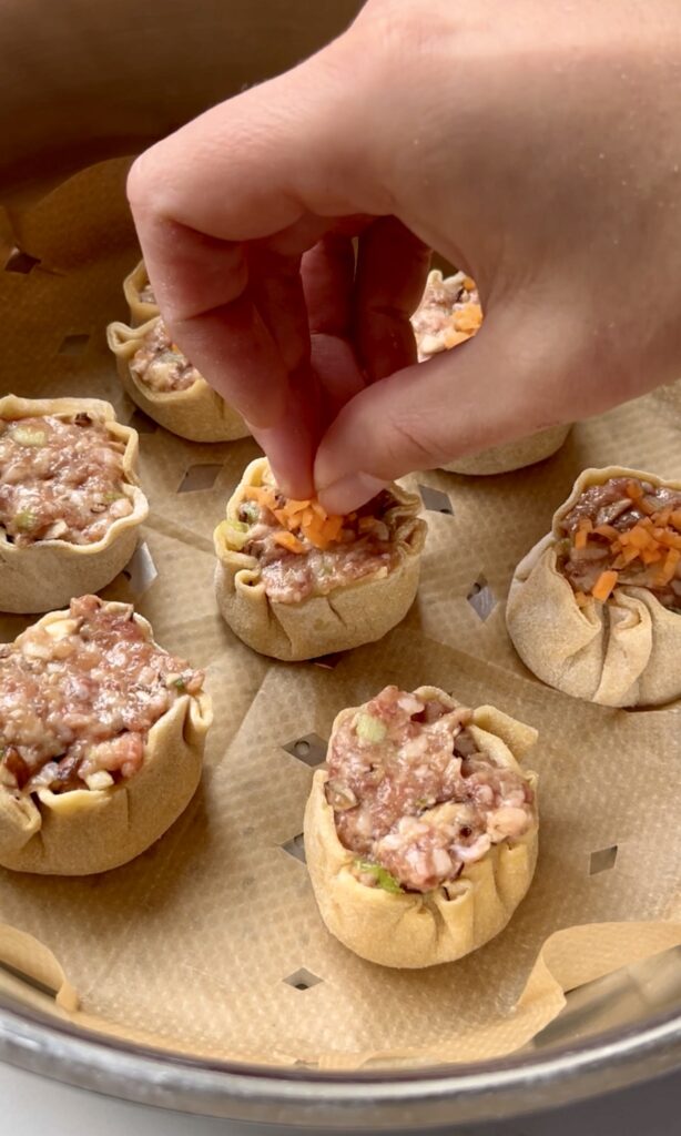 Fish roe or carrot on the dumpling