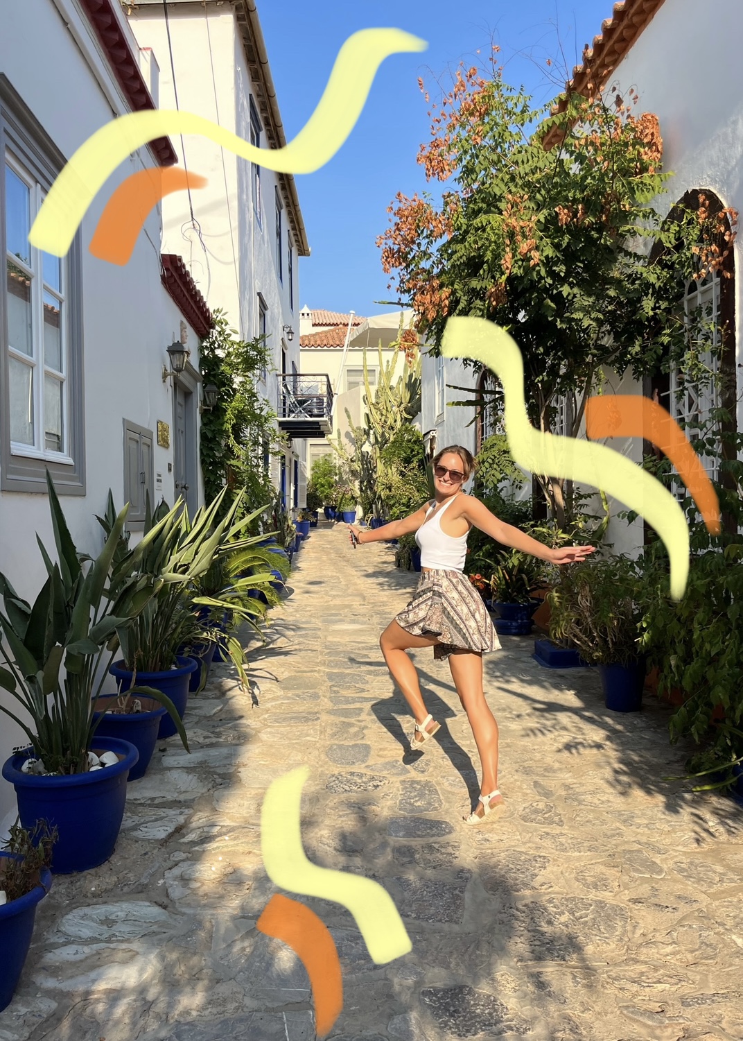 Girl walking along a cobbled street.