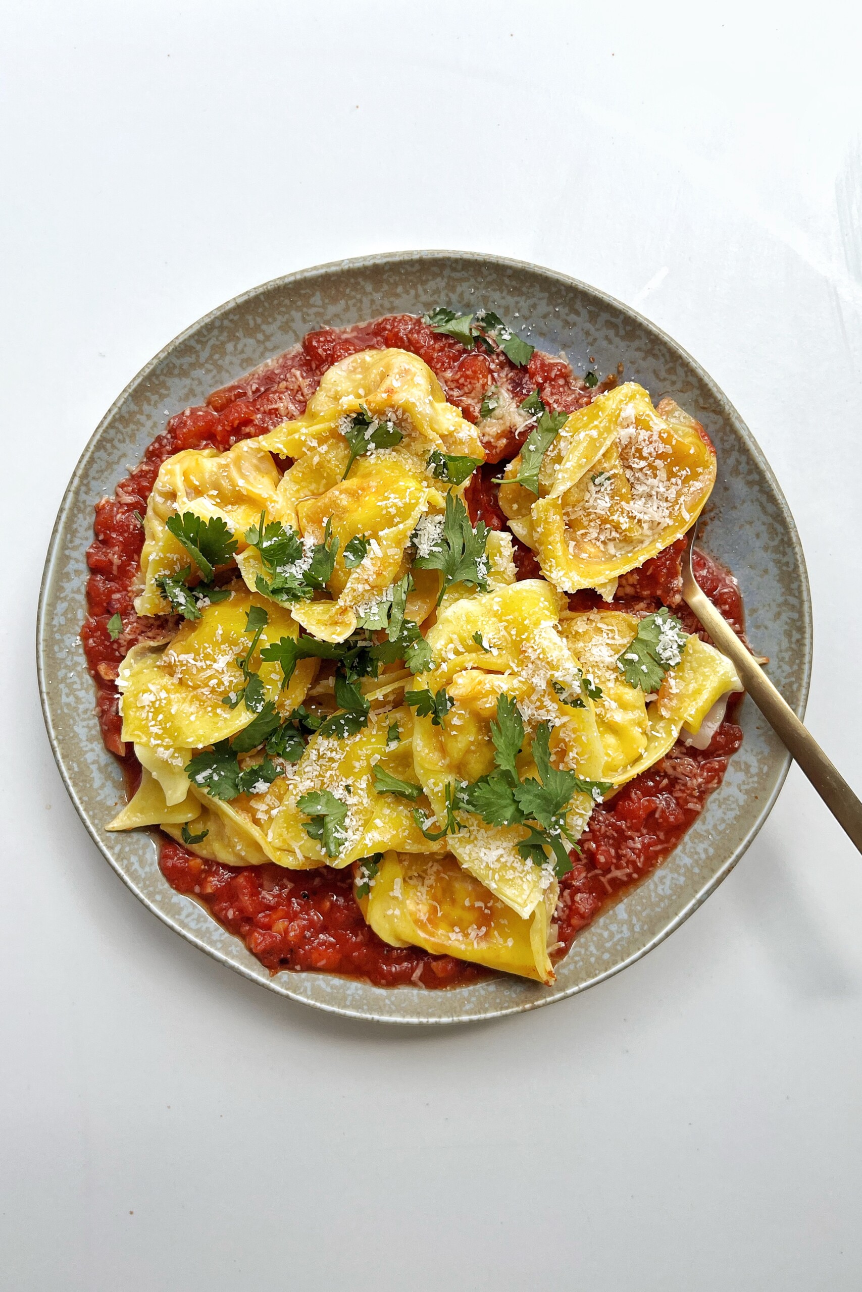 Spanish-style dumplings on a blue plate.
