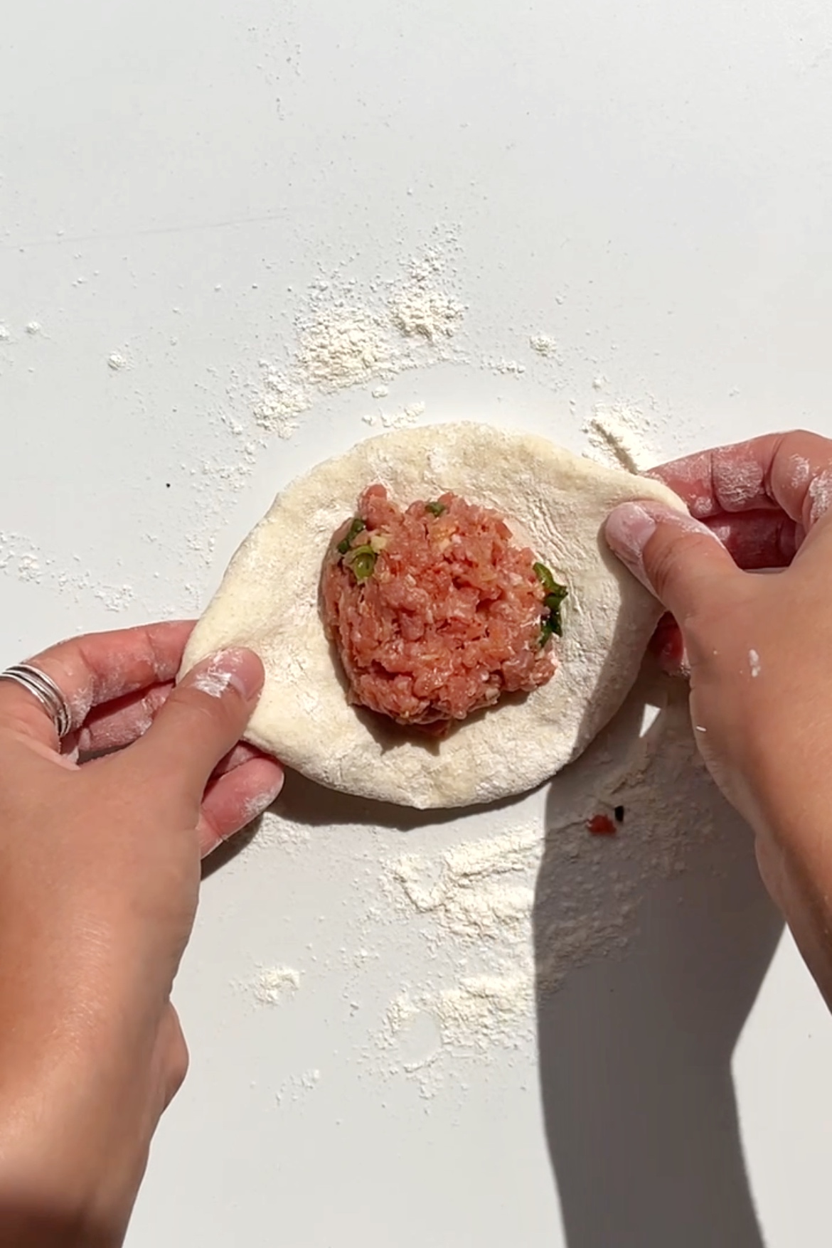 Wrapping up a bao bun with a pork and lemongrass filling.