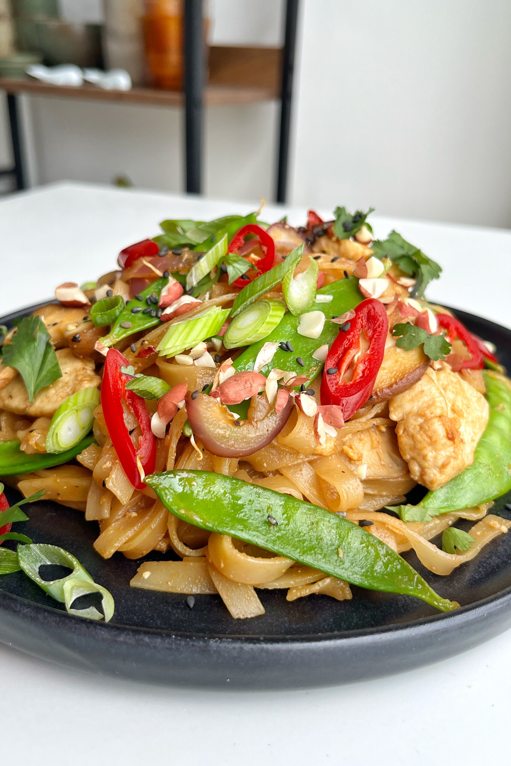 Wagamama pad Thai recipe on a black plate.