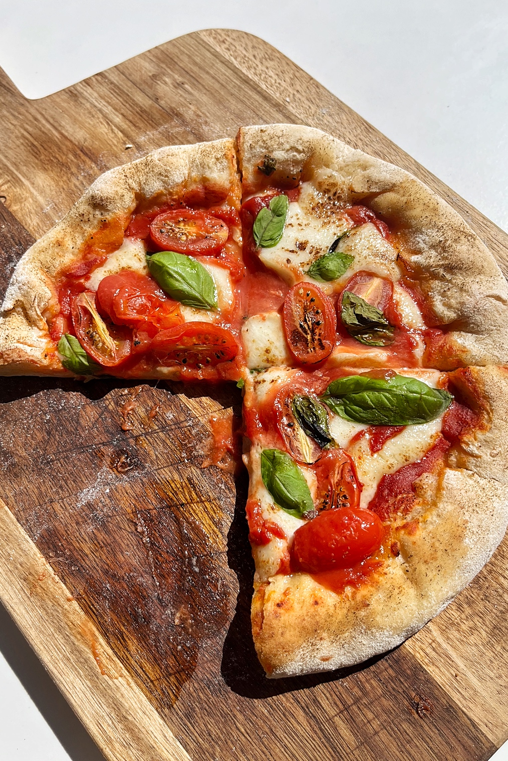 Easy stuffed crust pizza with one slice missing.