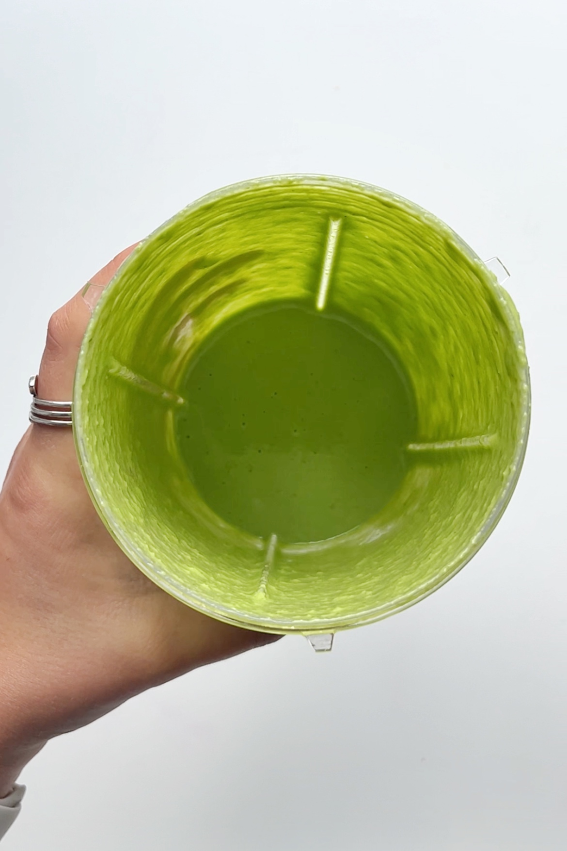 Green tahini miso sauce in a blender.