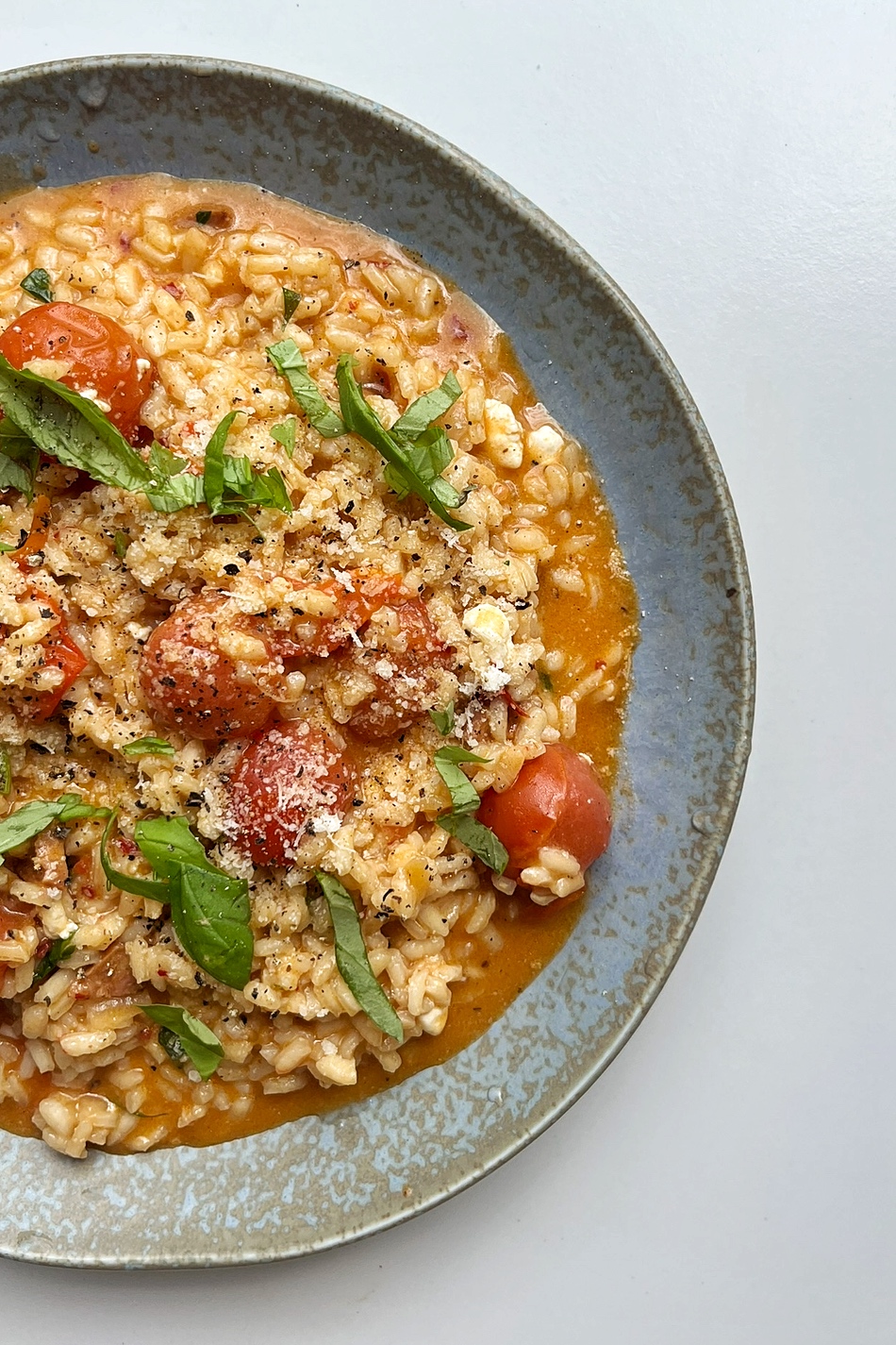 'Nduja risotto on a blue plate.