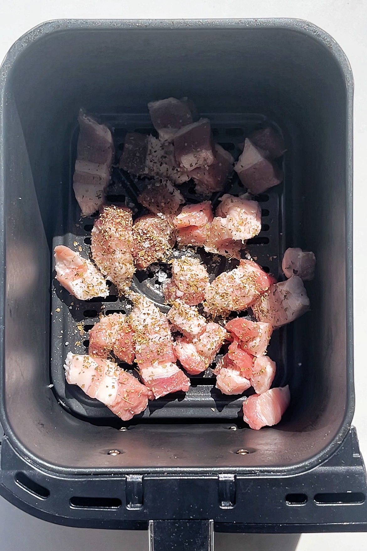 Air frying pork belly.