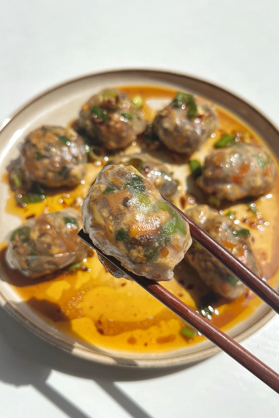 Close up of a steamed rice paper dumpling.