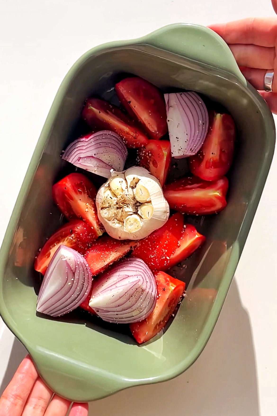 Roasting vegetables in a green tray.