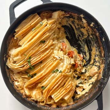 Boursin pie in a black pie with a spoonful taken out of the pie.