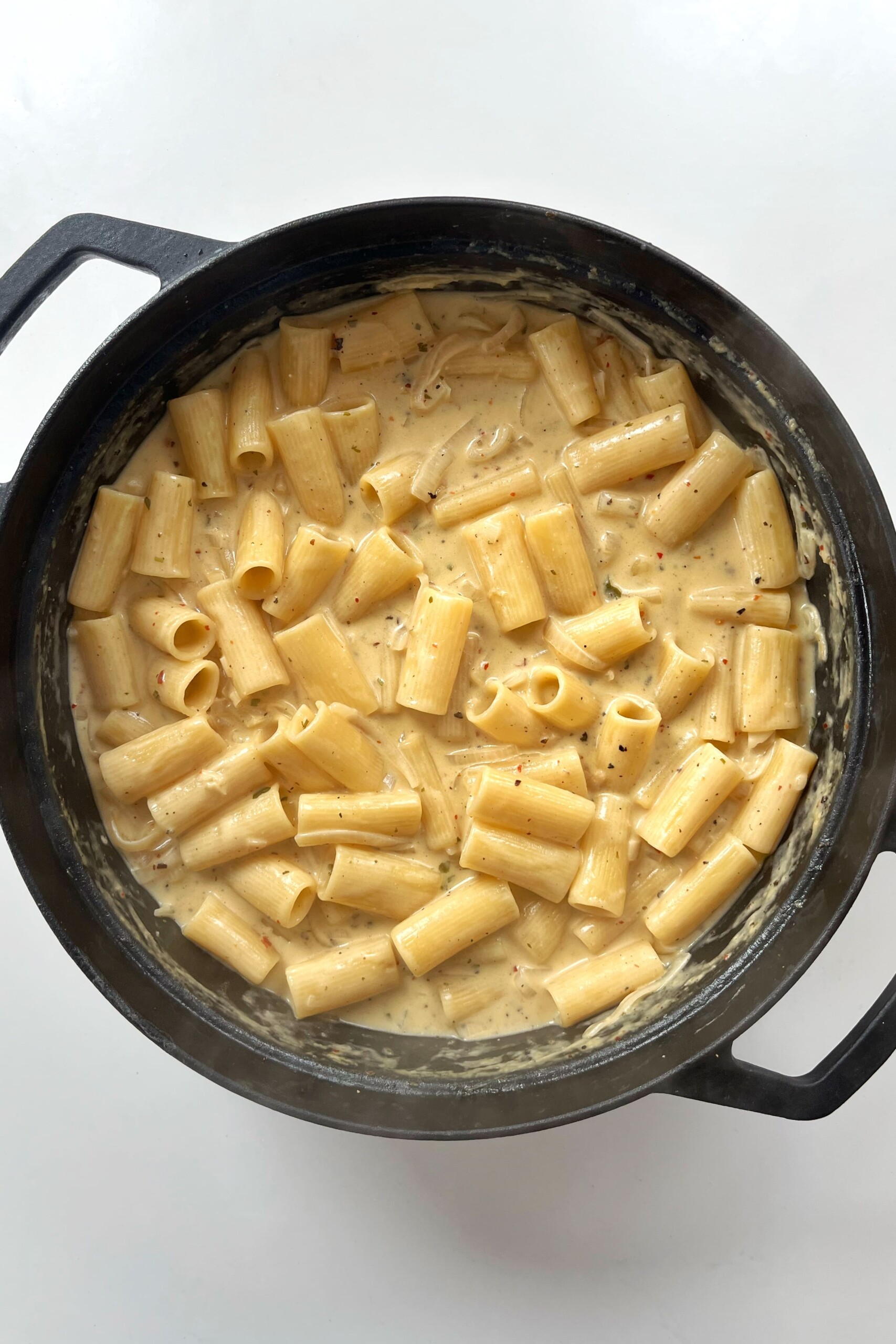Creamy lemon Boursin pasta in black pan.