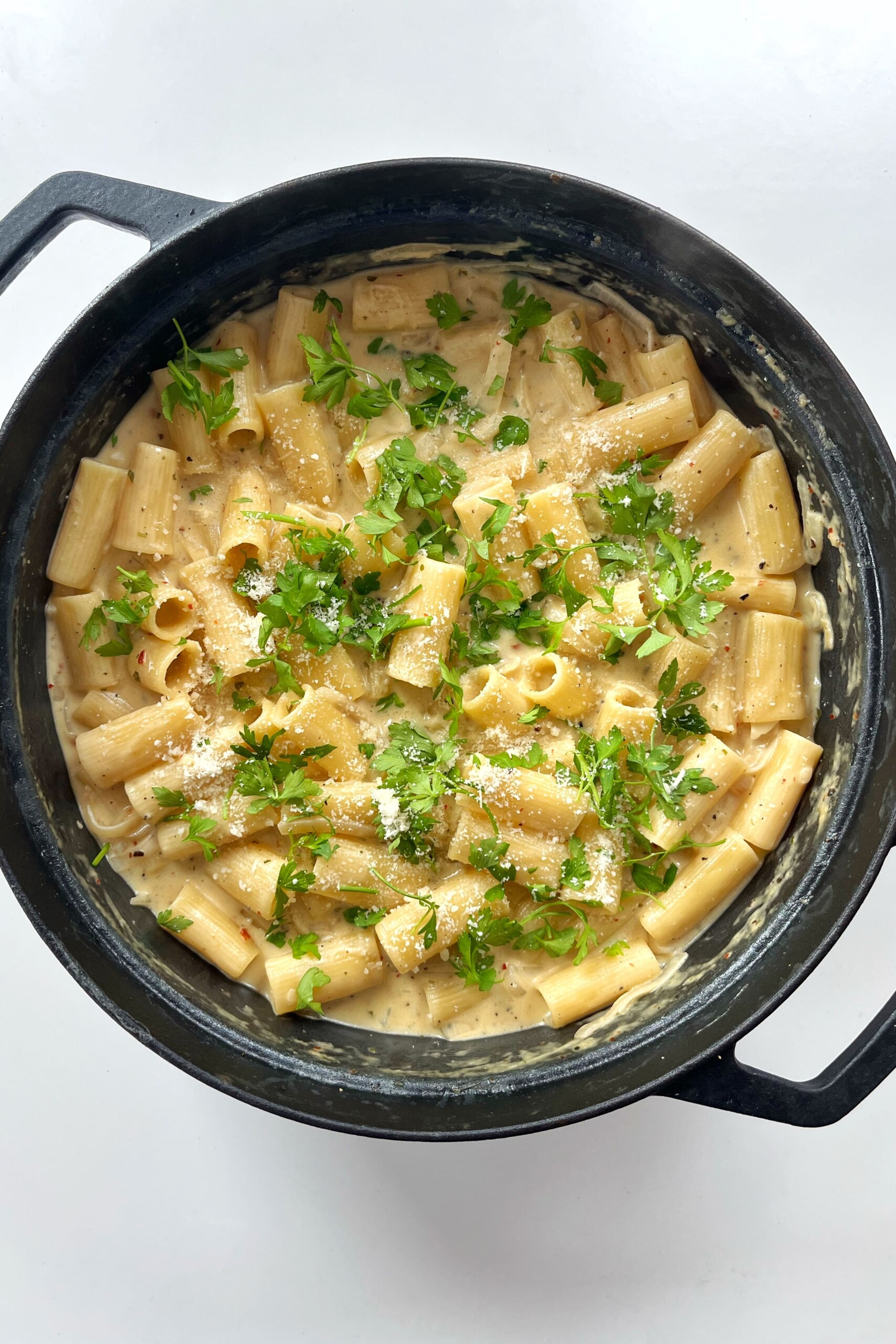 Black cooking pan with pasta inside.