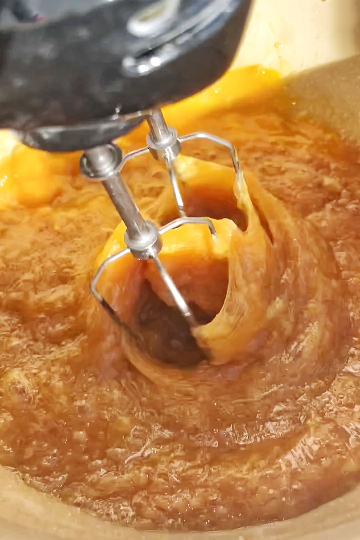 Whisking ingredients for a pecan pie.