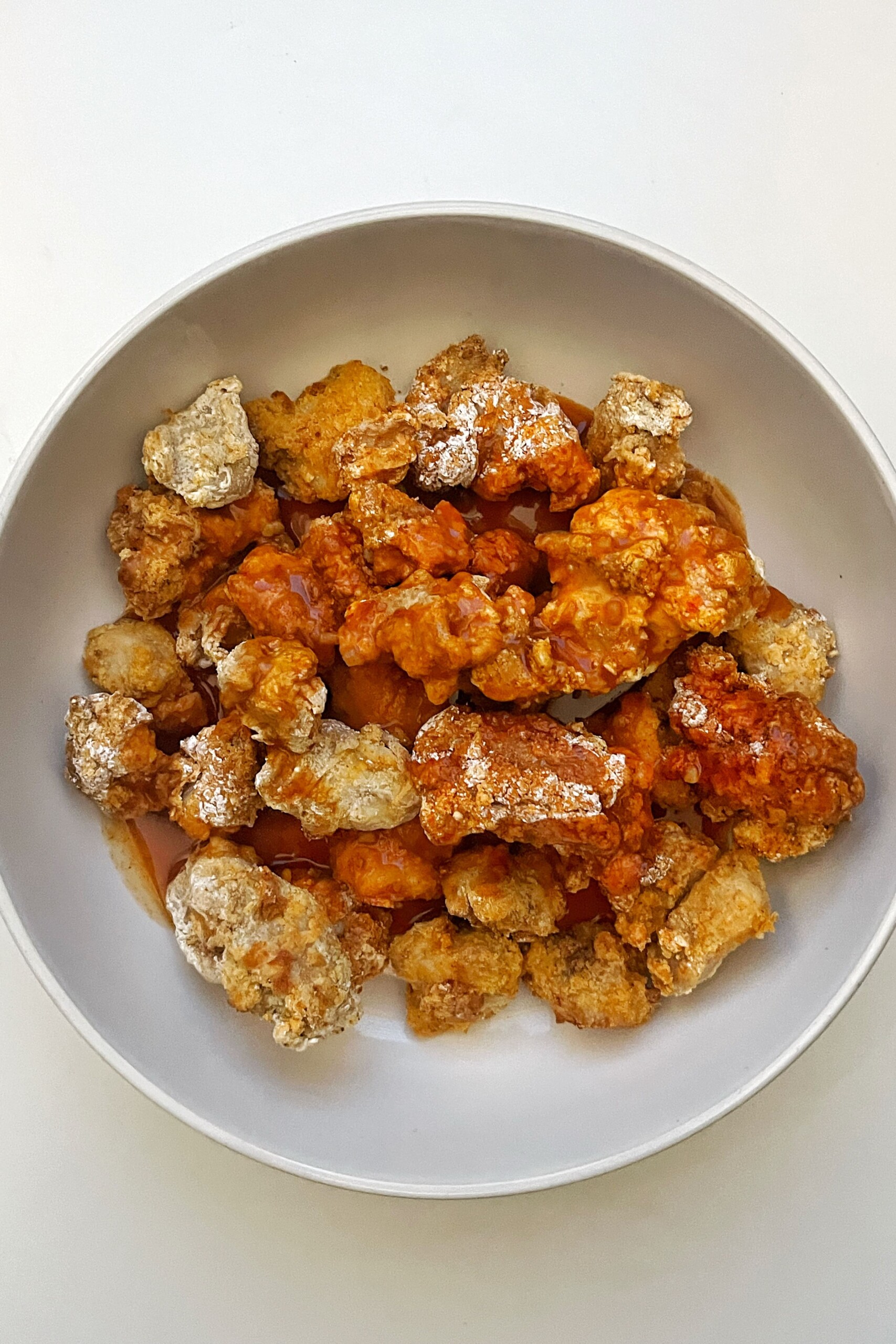 Tossed chicken in volcano chicken sauce.