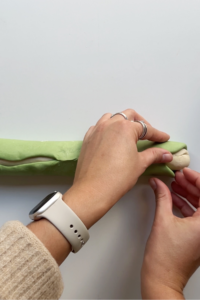 Pinching dough green and white.