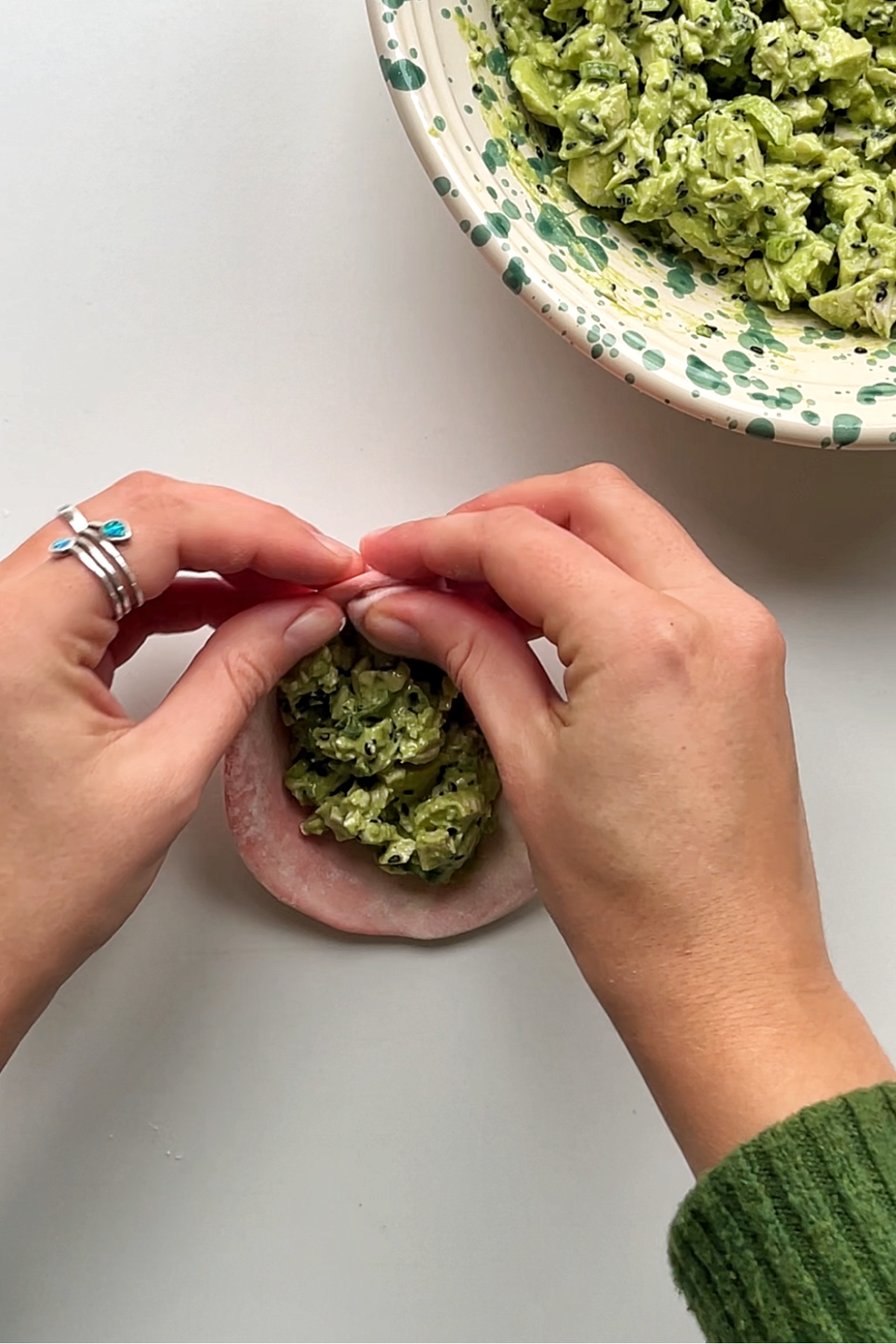 Wrapping up a dumpling.