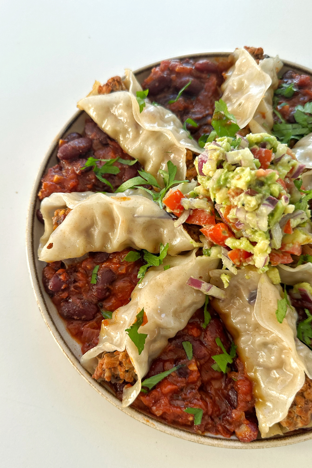 Open-ended chipotle pork and aubergine dumplings close up.