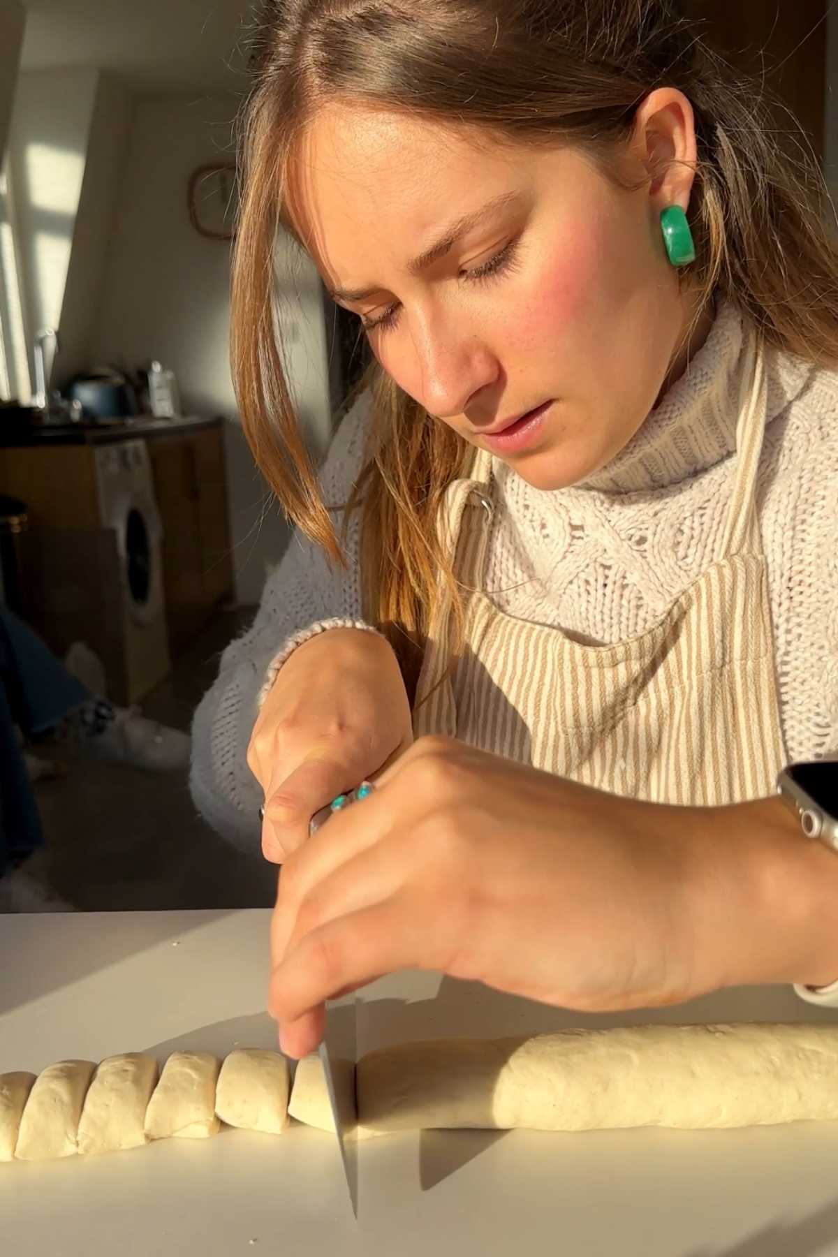 Slicing dough into pieces.