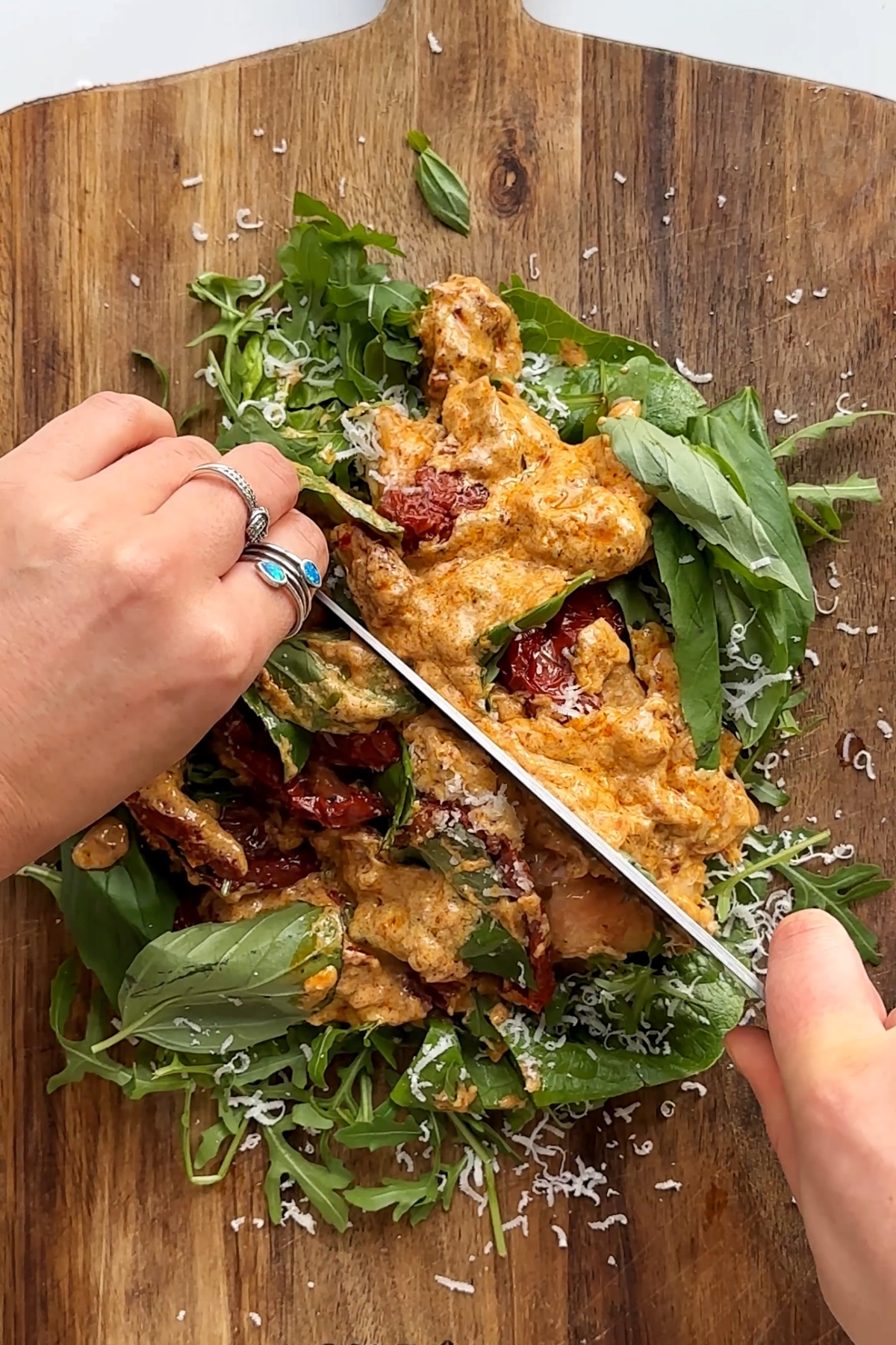 Chopping a salad on board.