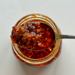 Chilli oil being picked up by spoon.