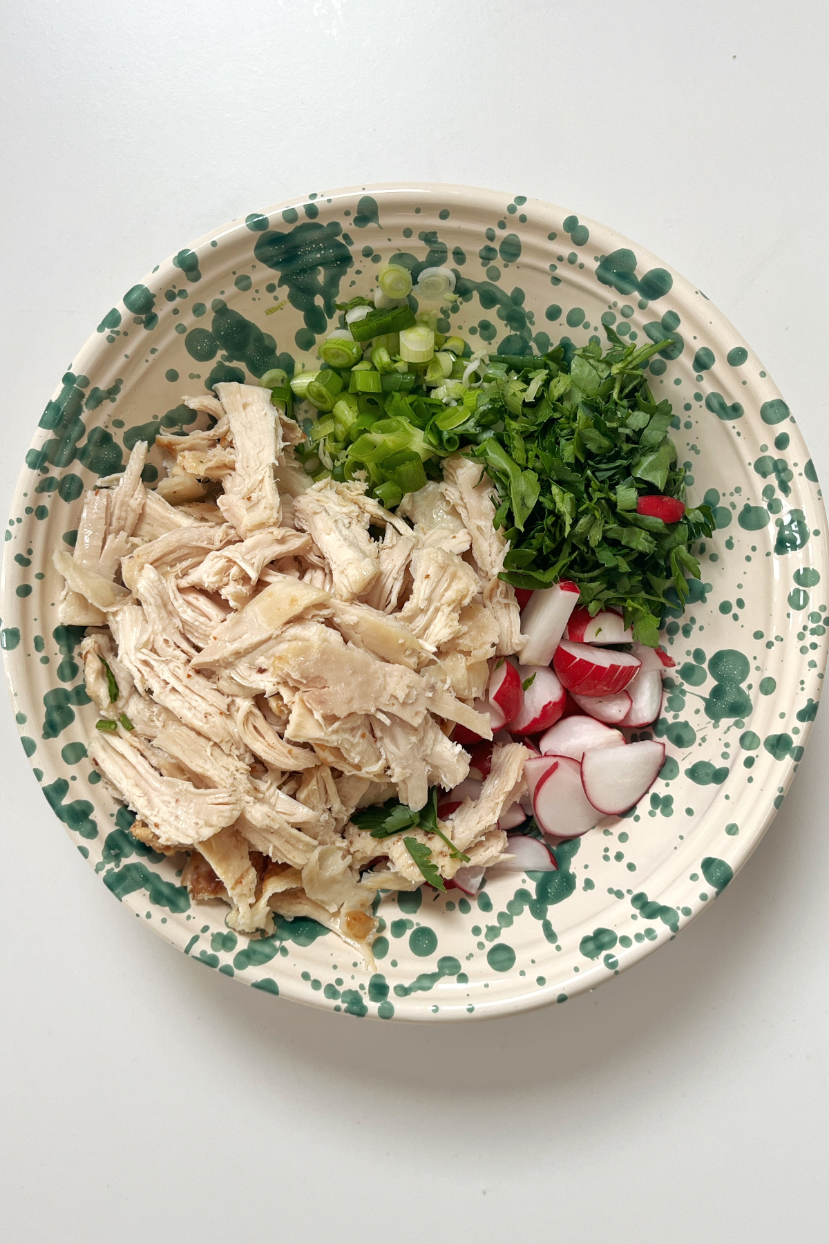 Chopped chicken salad ingredients in a bowl.