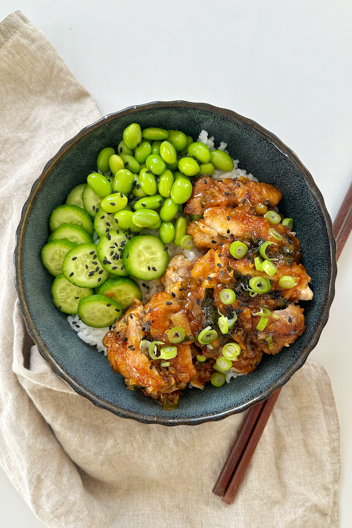 Scallion chicken with edamame beans and little cucumbers.