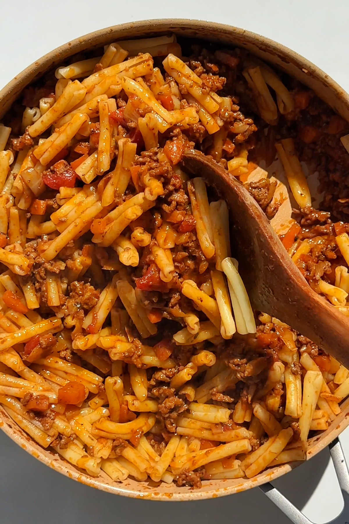 Cooking bolognese with casarecce pasta.