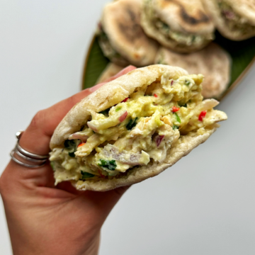 Holding up a cheat arepa with one hand.