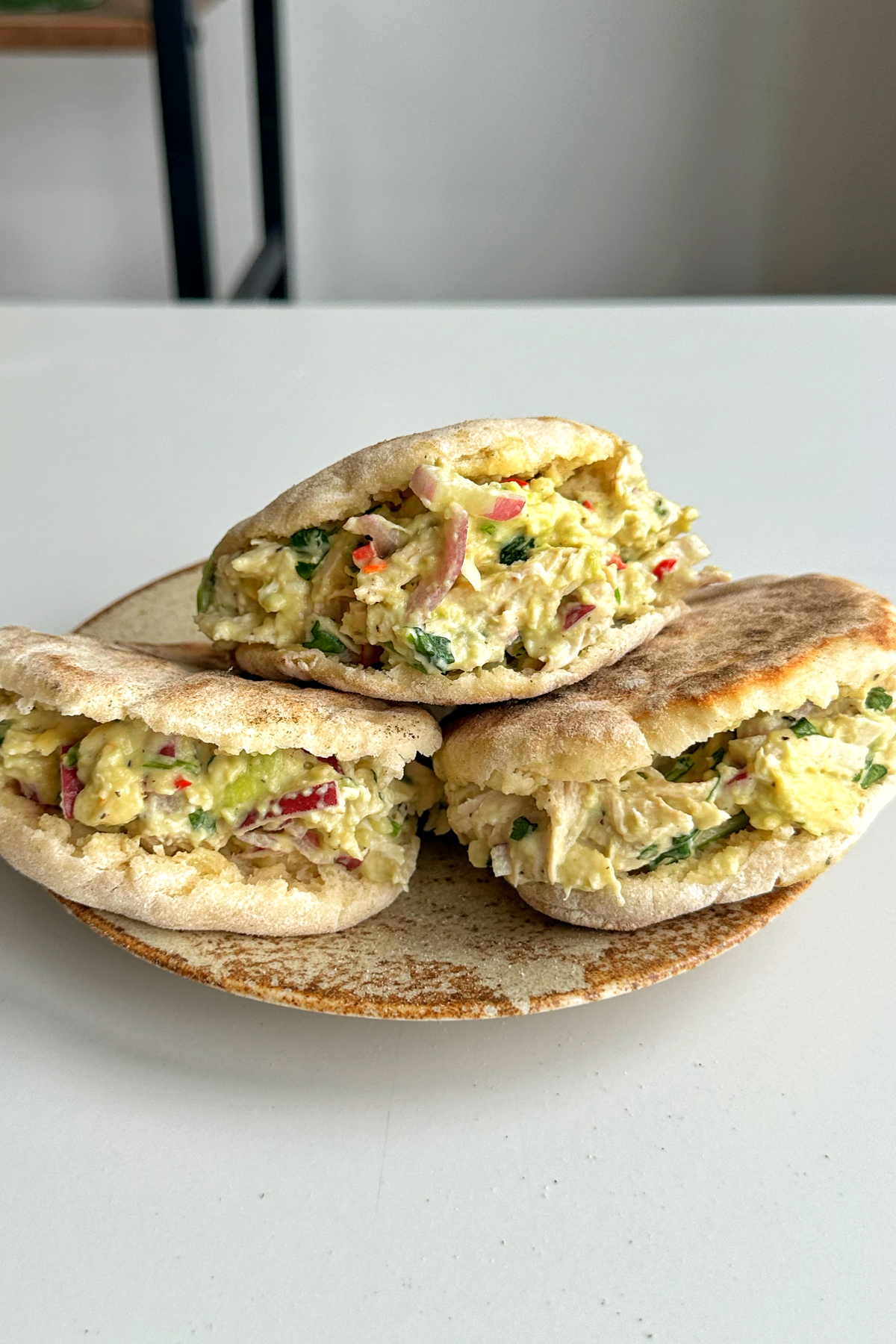 Three arepas placed on top of a plate.