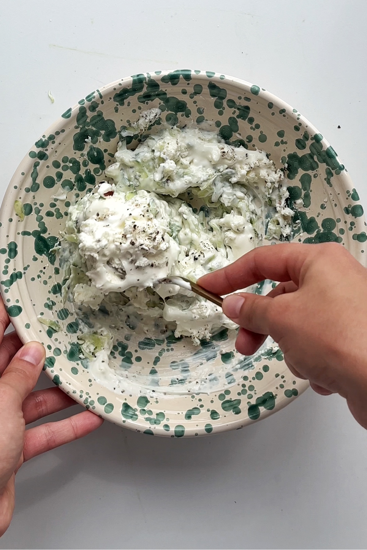 Making homemade tzatziki in a bowl.