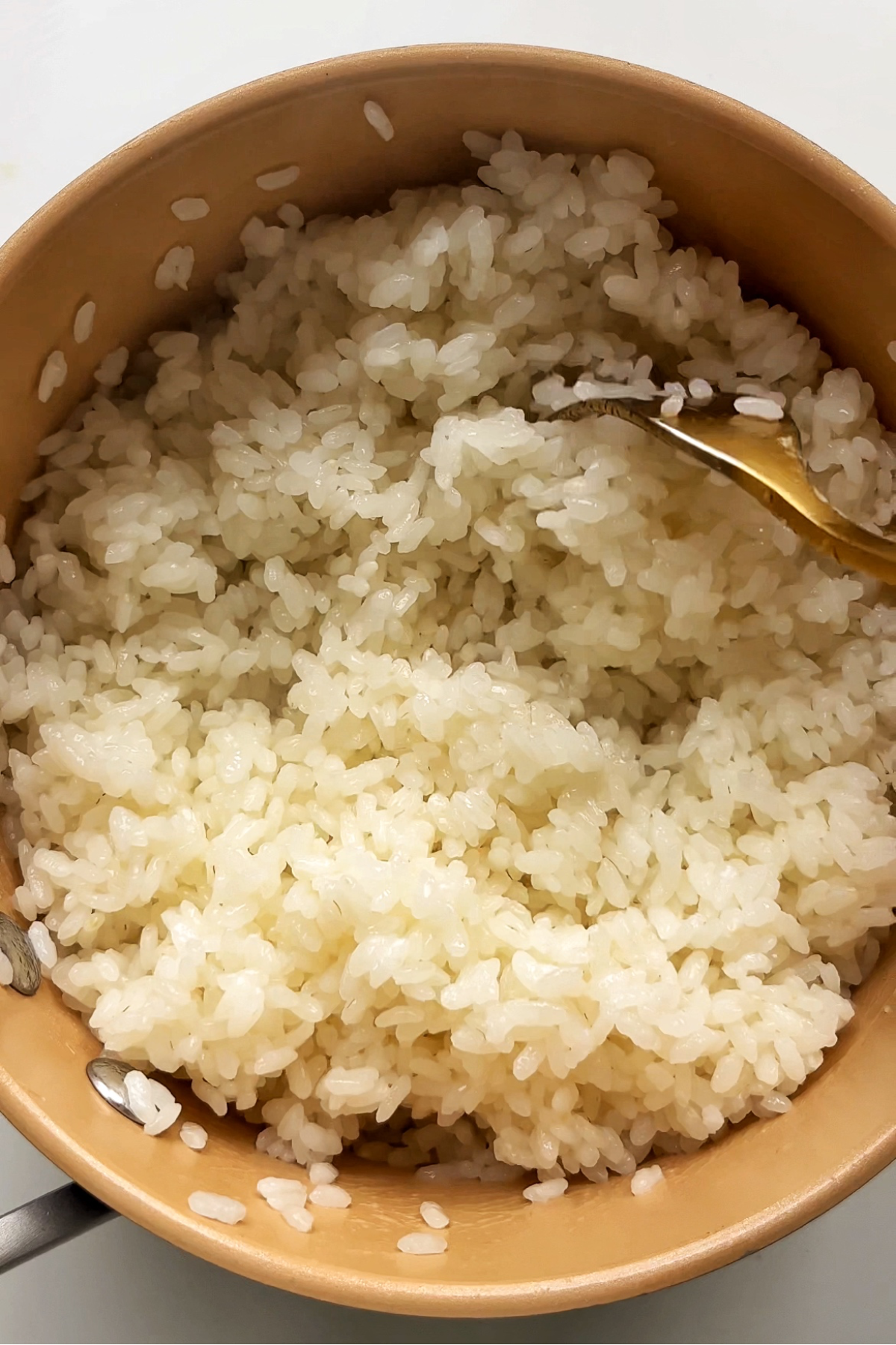 Fluffy rice in a saucepan.