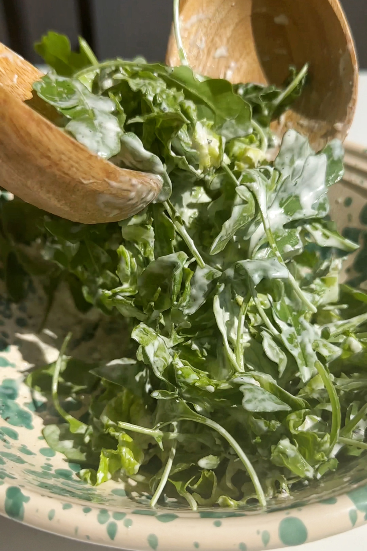 Making a zingy salad for the crunchy chicken romesco sandwich.