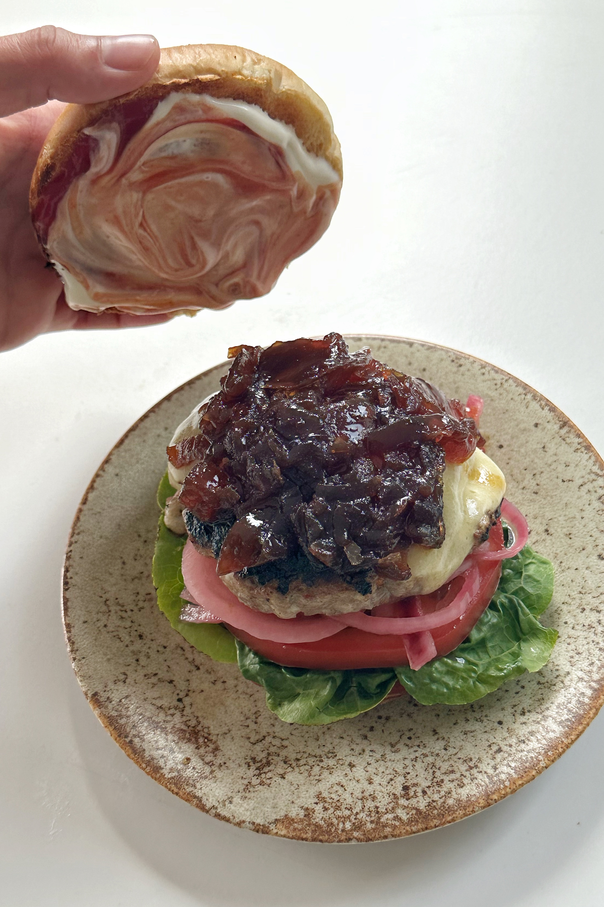 Assembling a hamburger.