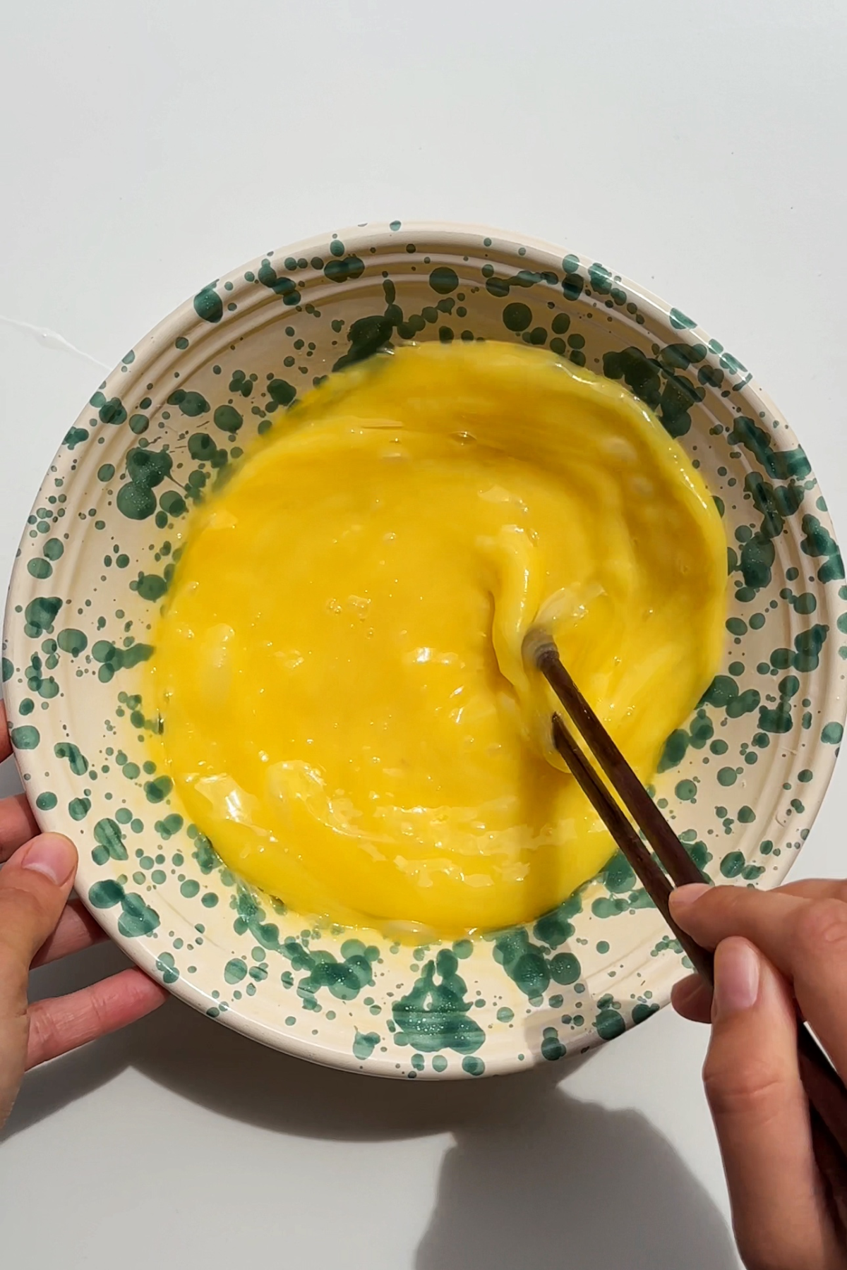 Whisking eggs in a bowl.