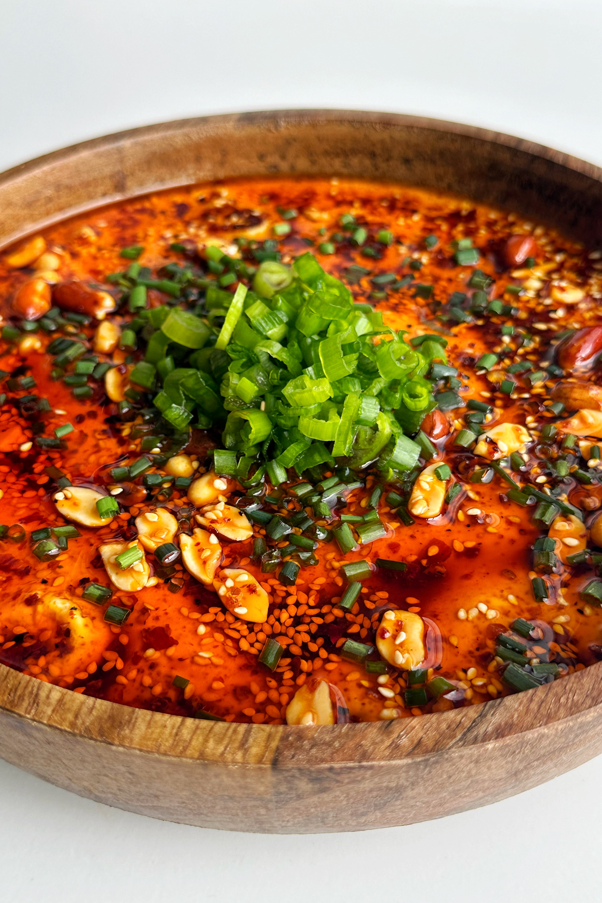 Side profile of steamed eggs with chili oil.