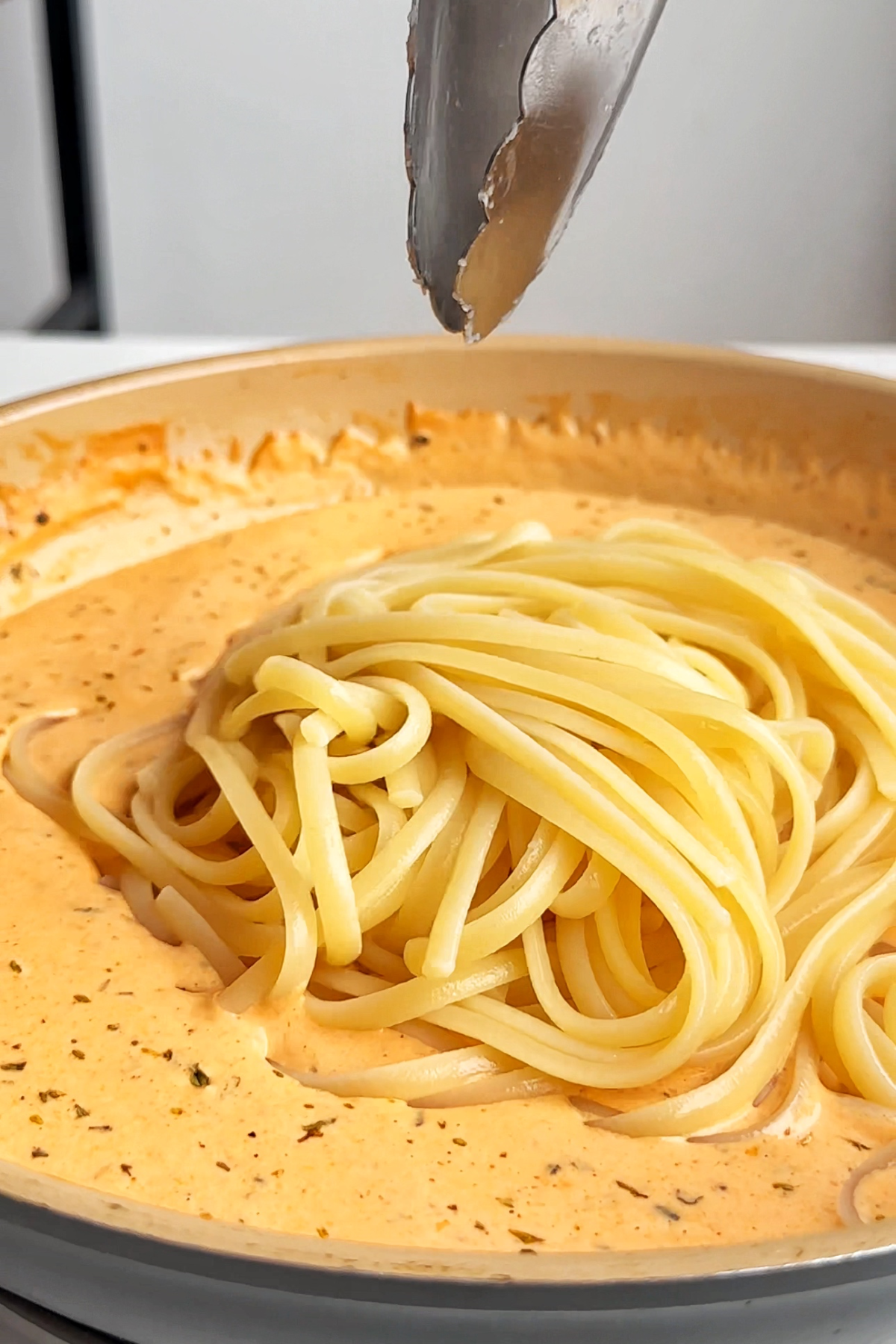 Combining pasta with spicy alfredo sauce.