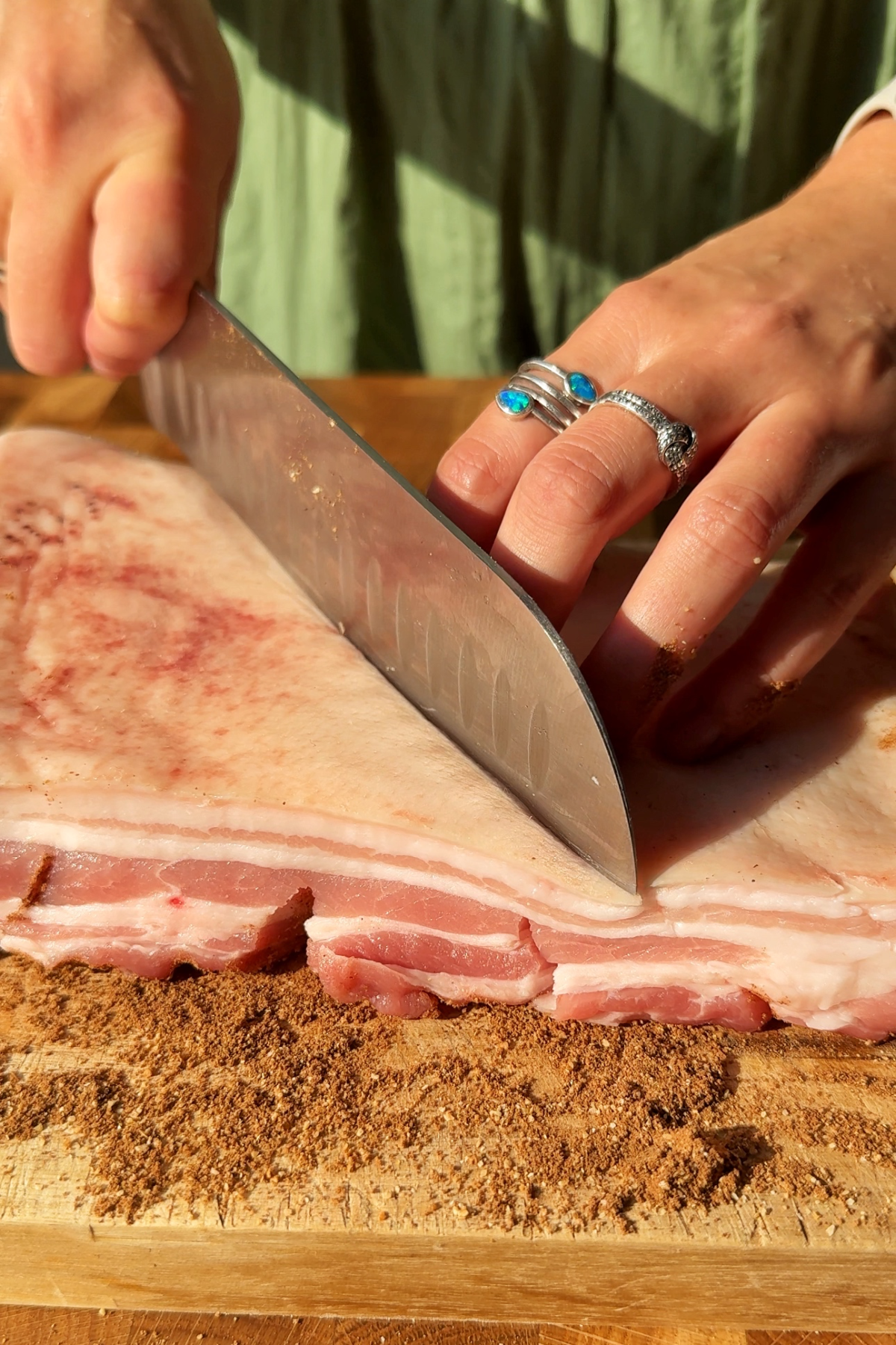 Scoring the skin of belly pork.