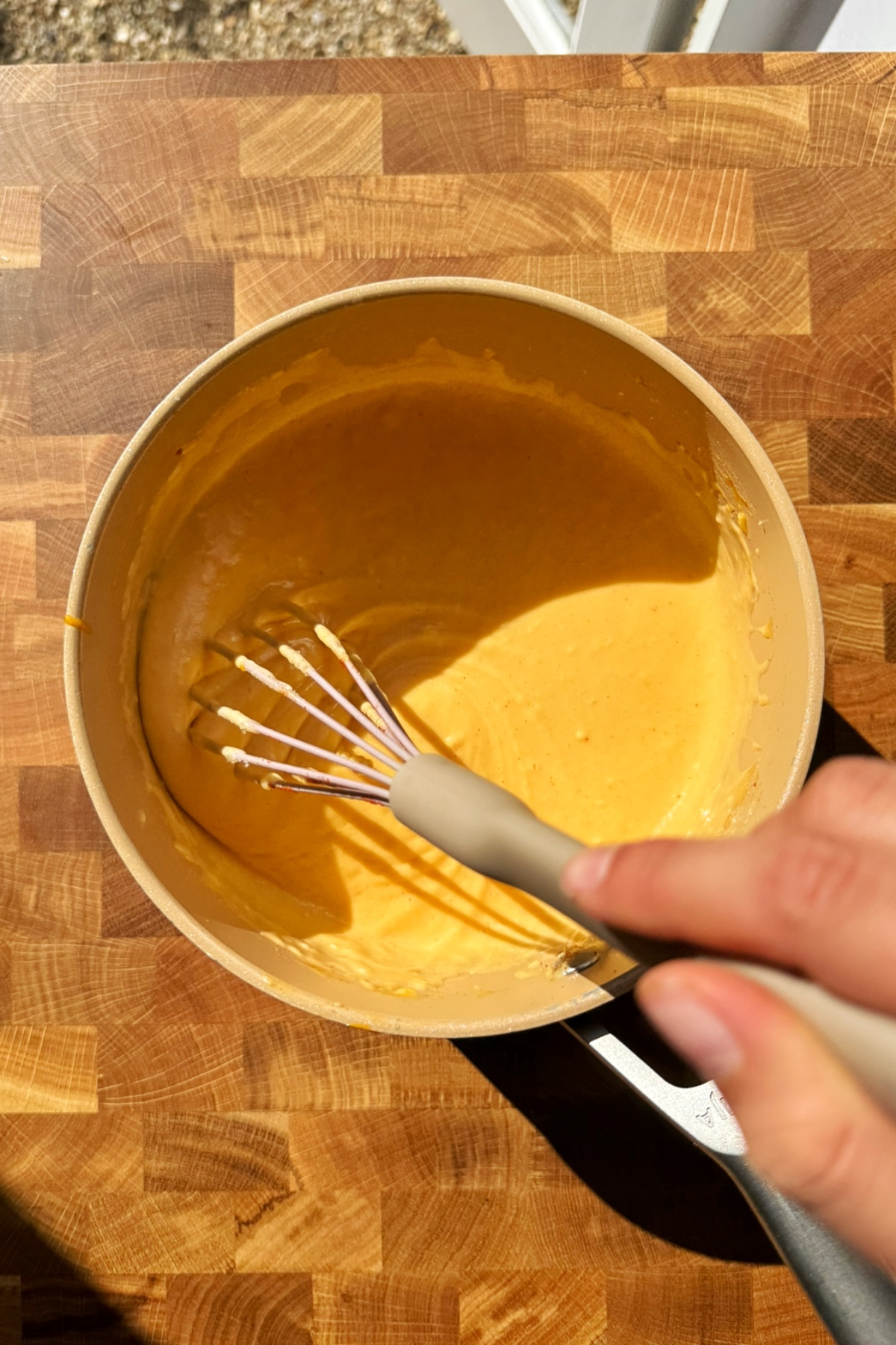 Making a cheese sauce.