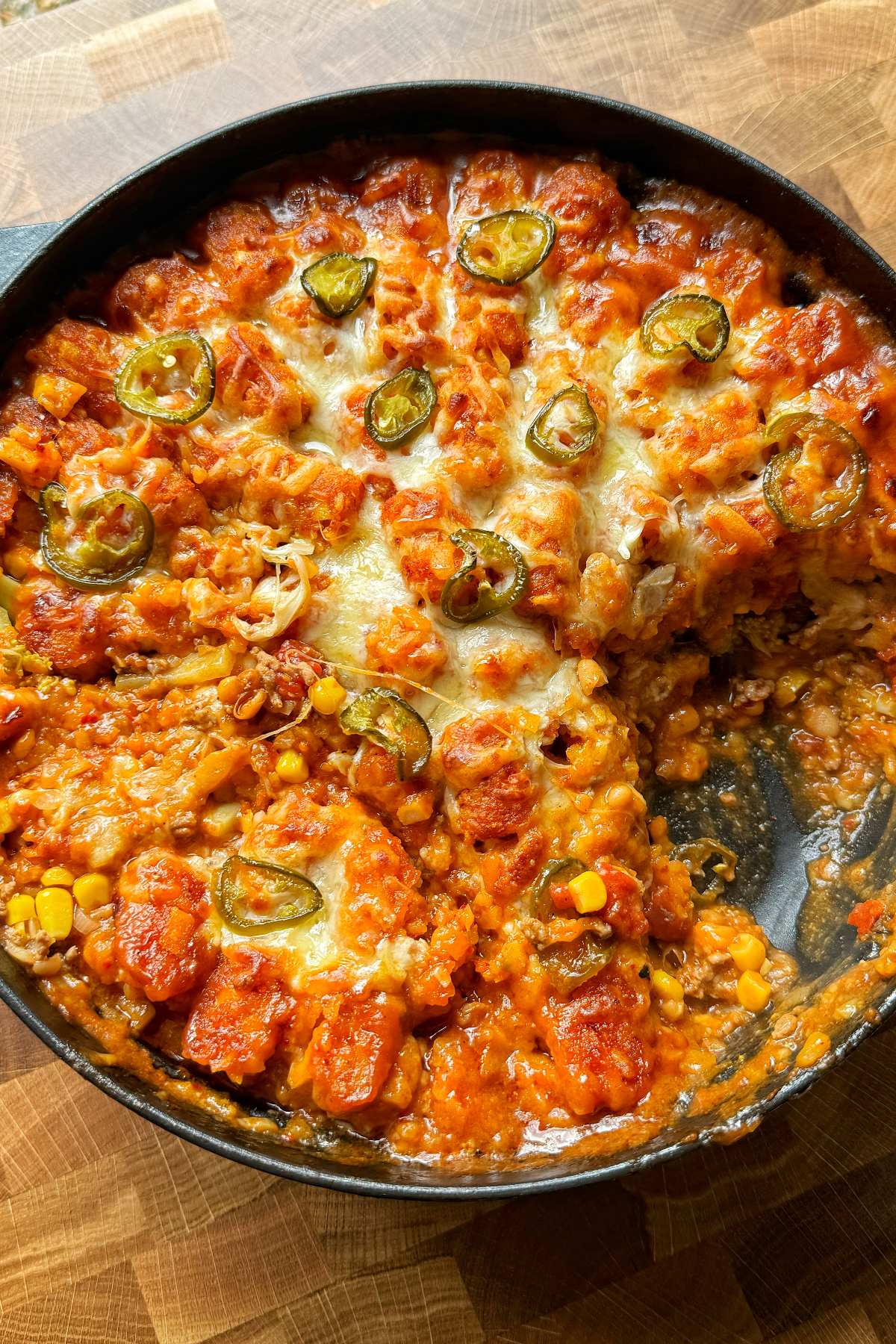 Cowboy casserole in a black skillet.