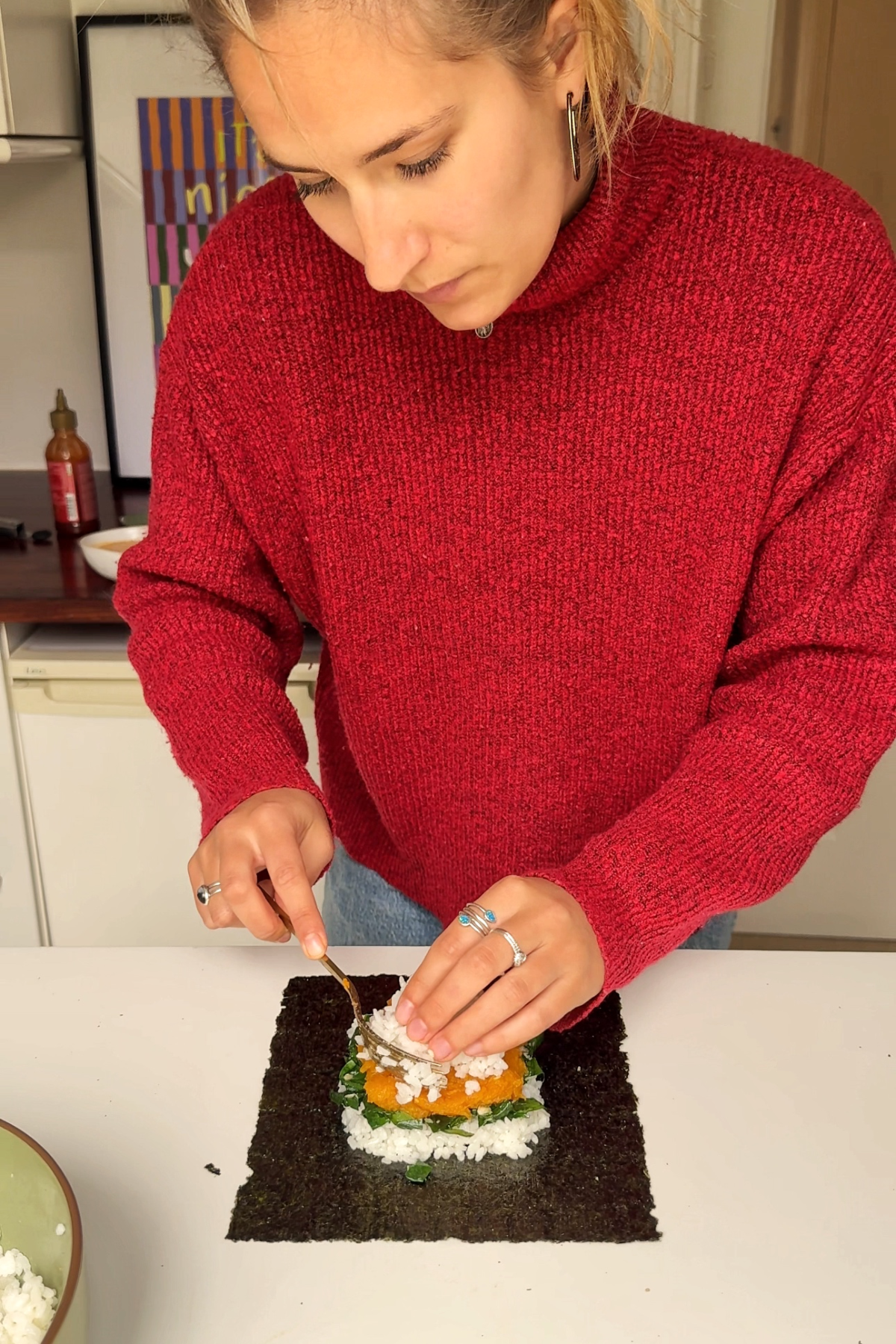 Assembling the sushi sandwich.