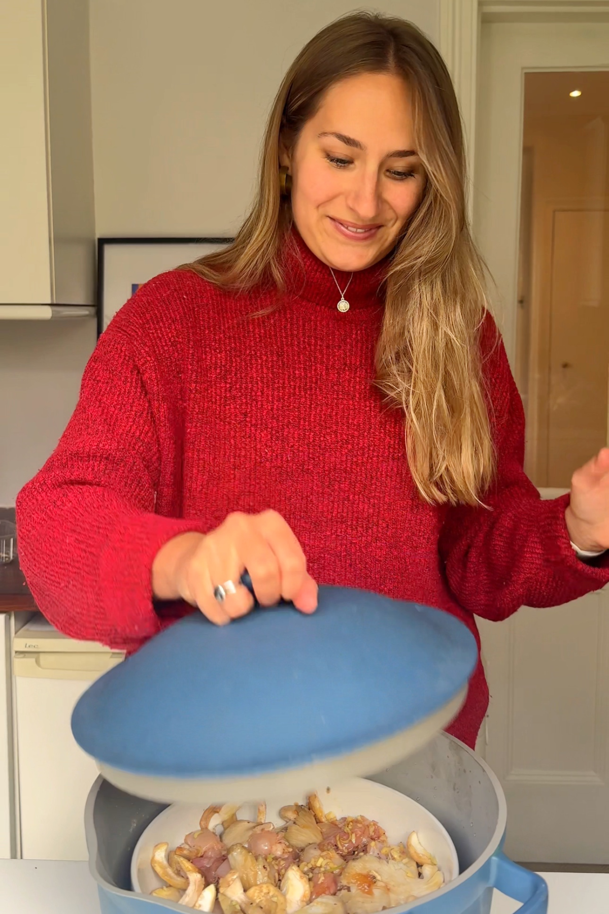 Placing the chicken into the steamer.