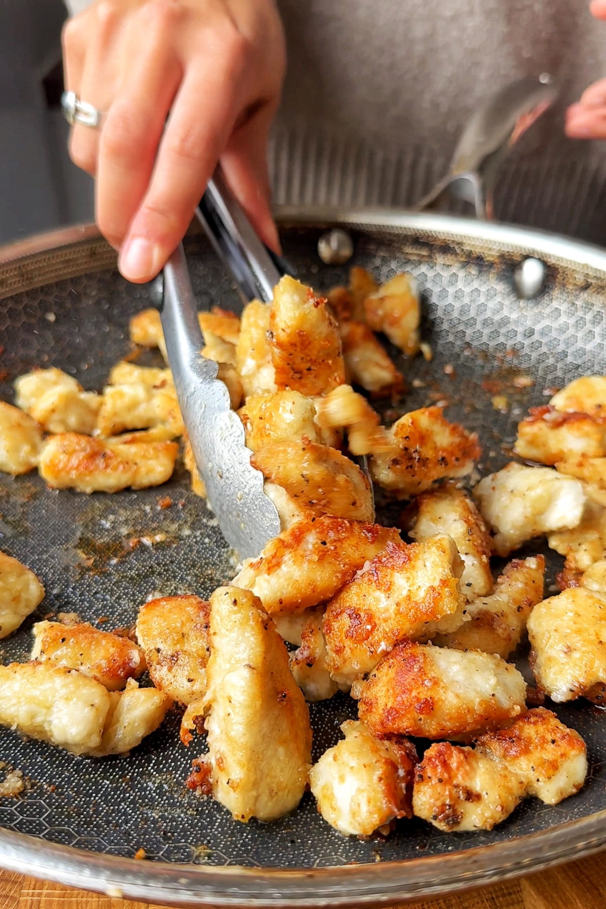 Fry chicken breast cubes.