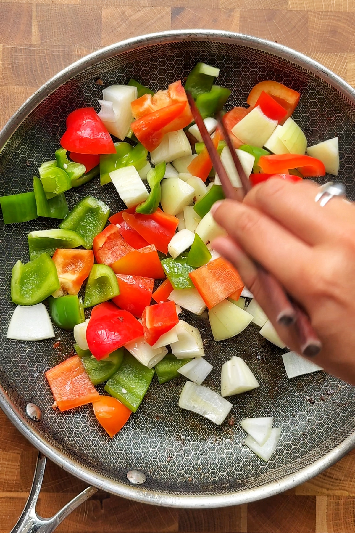 Fry red and green bell peppers.