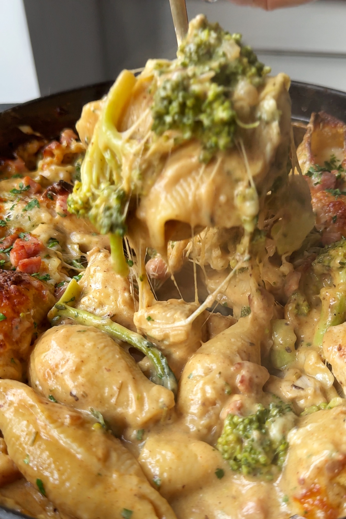 Cheese pull for a chicken and broccoli pasta bake.