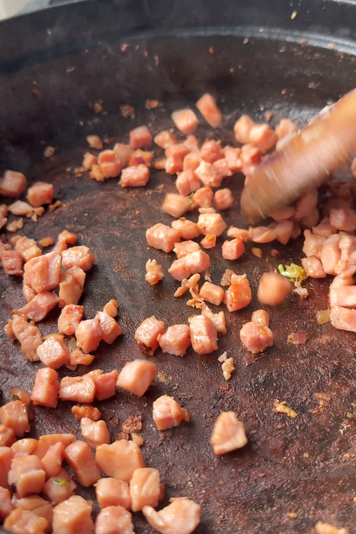Frying bacon in a pan.