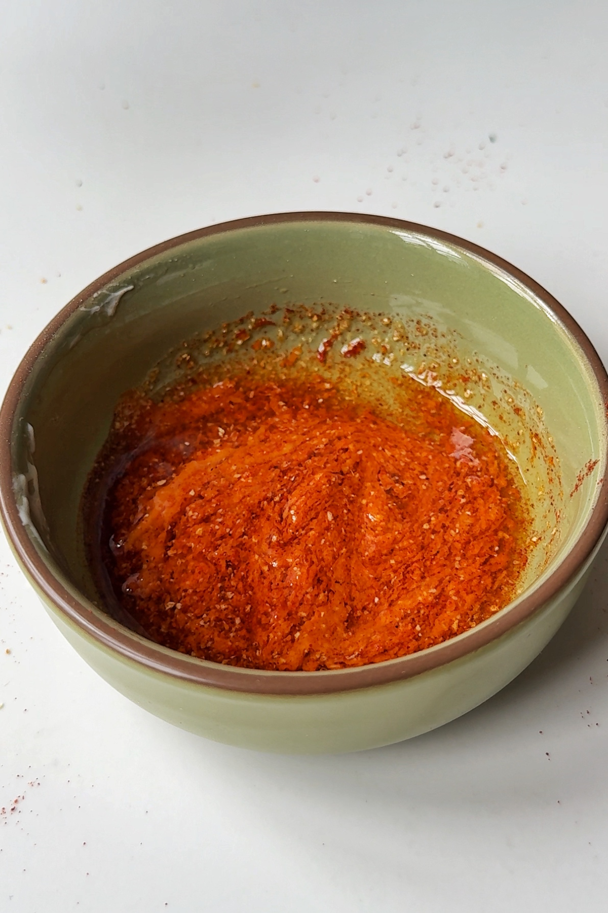 Making the hot oil sauce for the fried chicken.