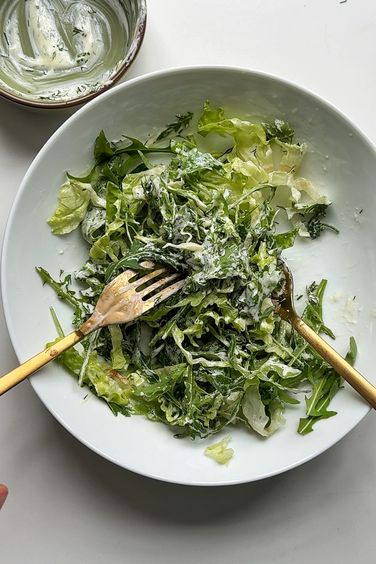 Making a salad for our hot honey chicken sandwich.