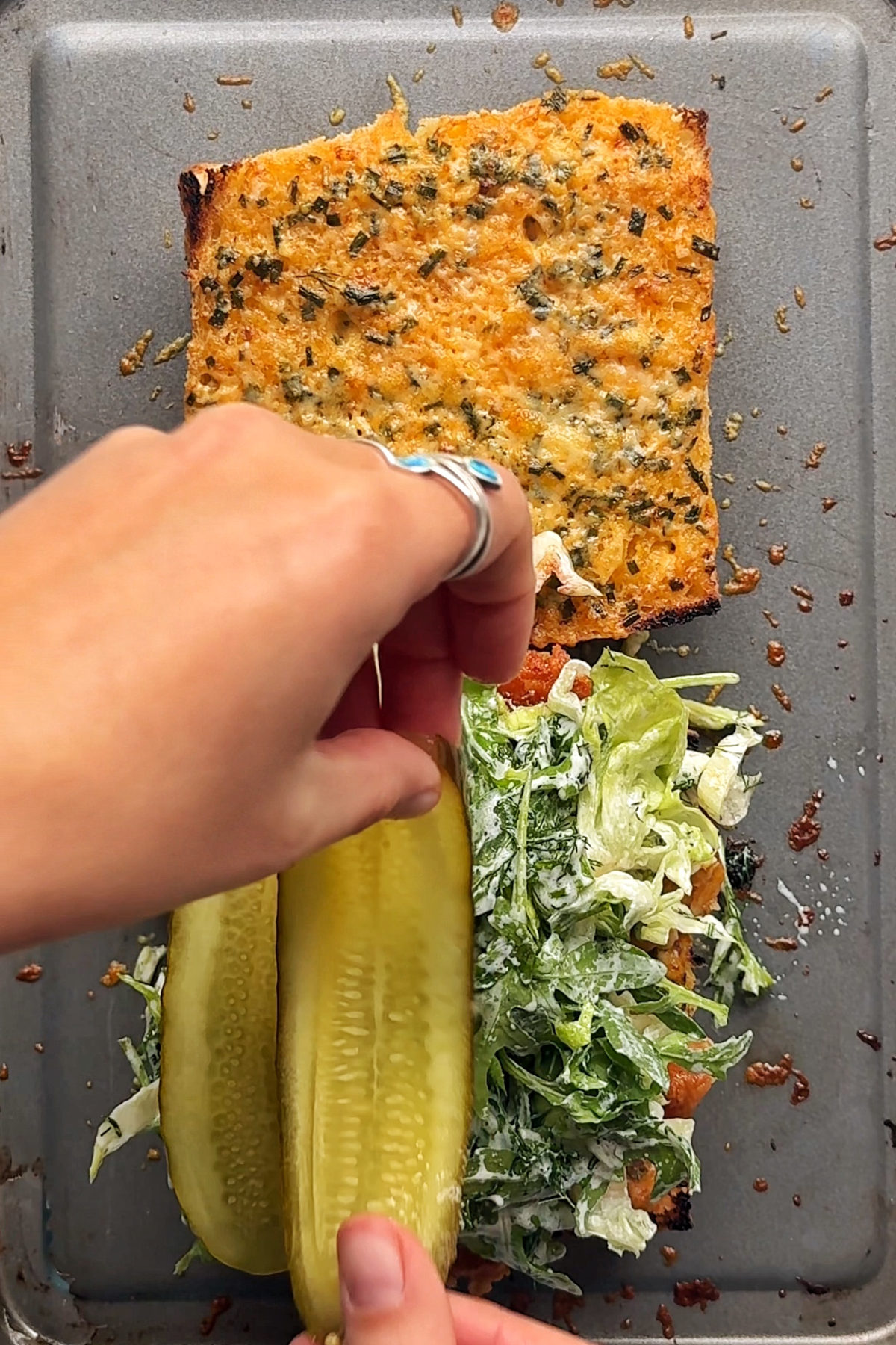 Layering all of our elements for the hot honey chicken sandwich.