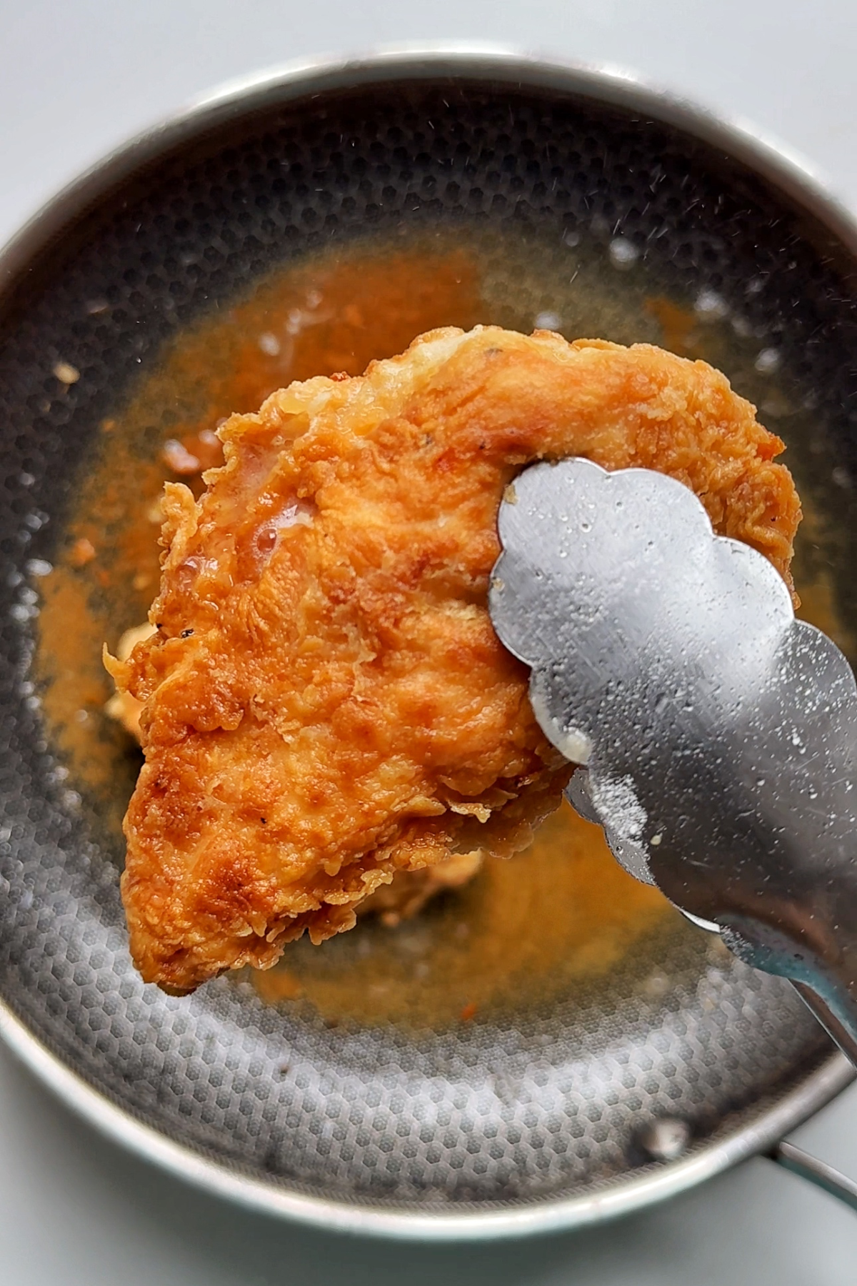 Frying your chicken cutlets.