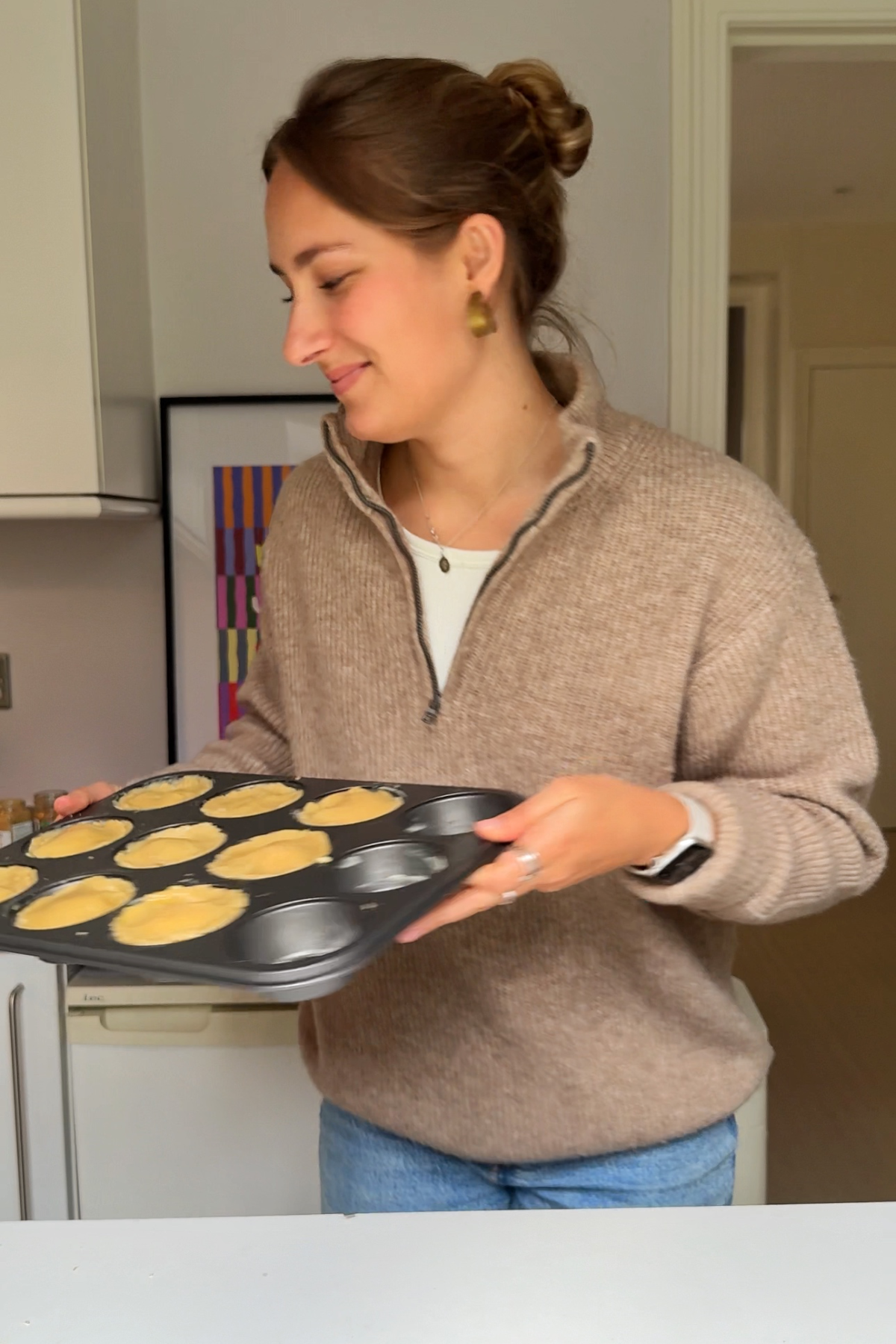Putting the mince pies in the oven.