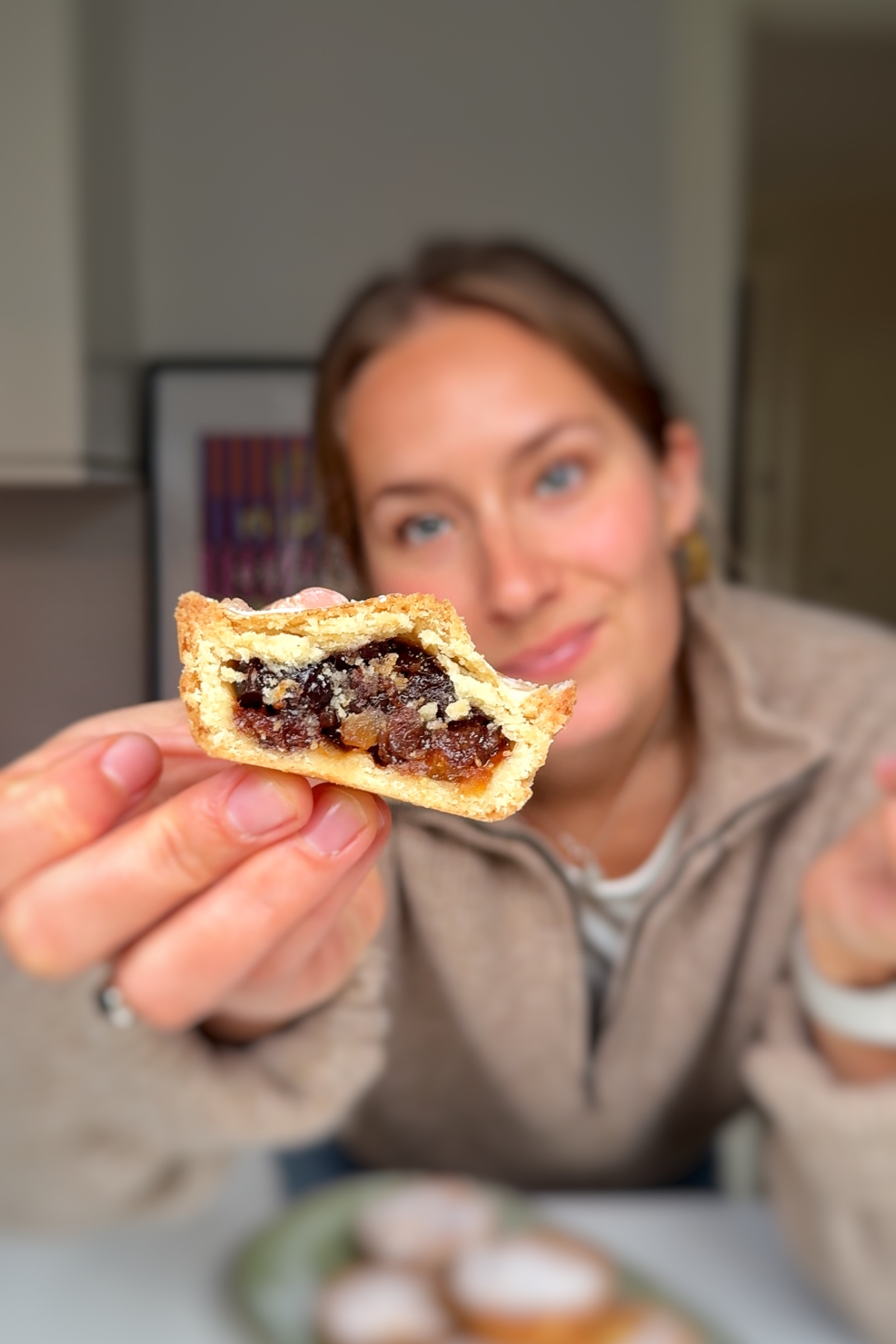 Showing mince pie to the camera.