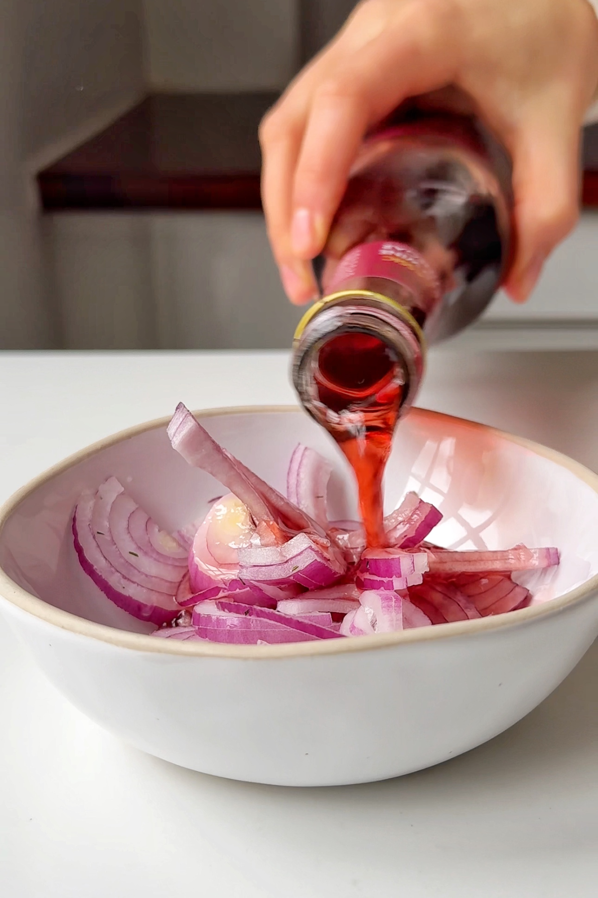Making pickled red onions.